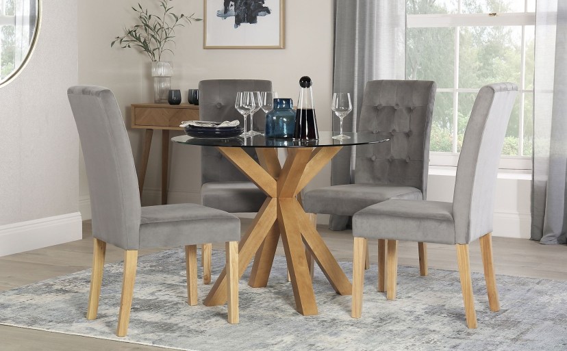 hatton round oak and glass dining table with 4 regent grey velvet chairs