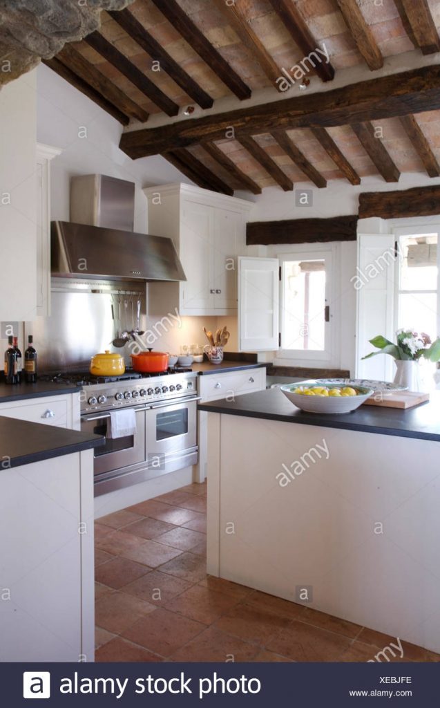 modern italian country kitchen with rustic wooden ceiling