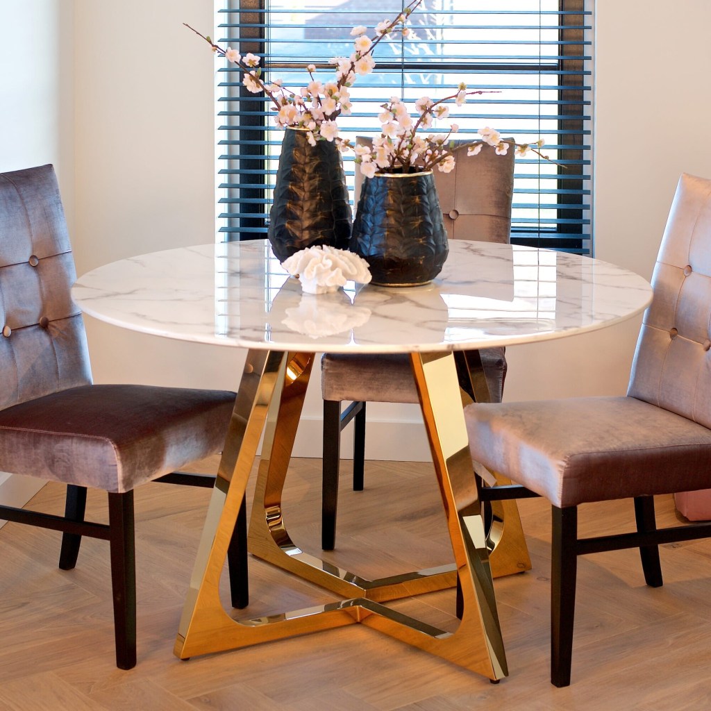 contemporary round faux marble and gold finish dining table