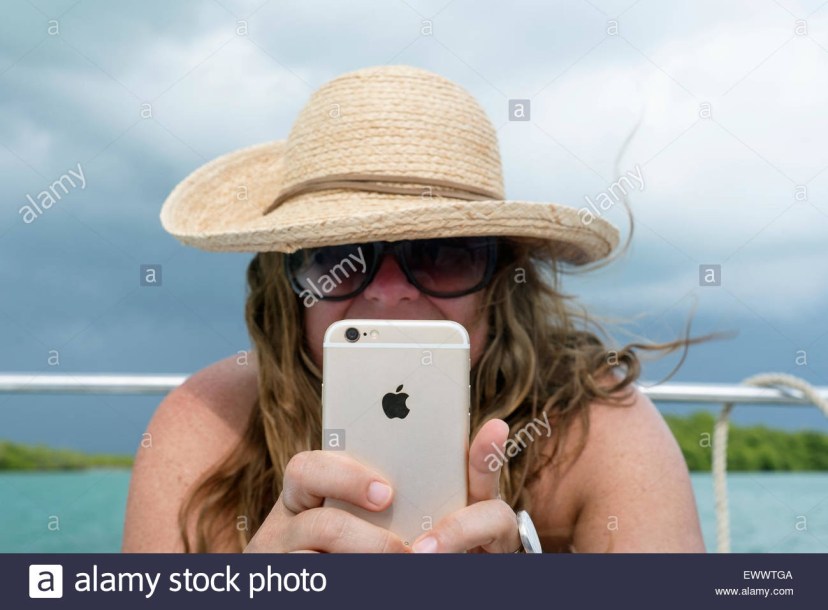 woman holding iphone 6 high resolution stock photography and