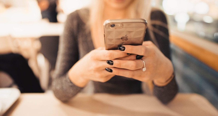 woman holding iphone in her hands free stock photo picjumbo