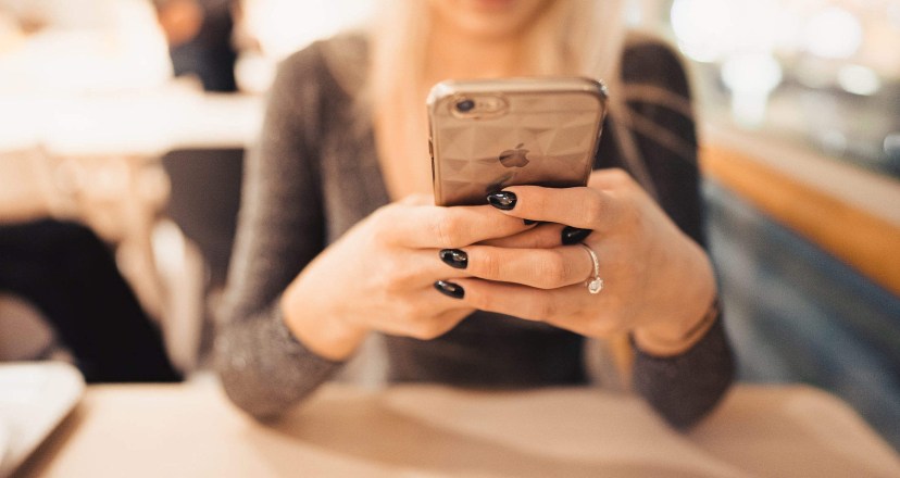 woman holding iphone in her hands free stock photo picjumbo