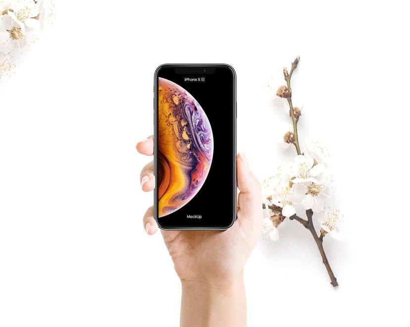 woman holding iphone xs mockup free mockup